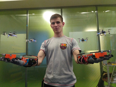 SwarmCloak: Landing of a Swarm of Nano-Quadrotors on Human Arms